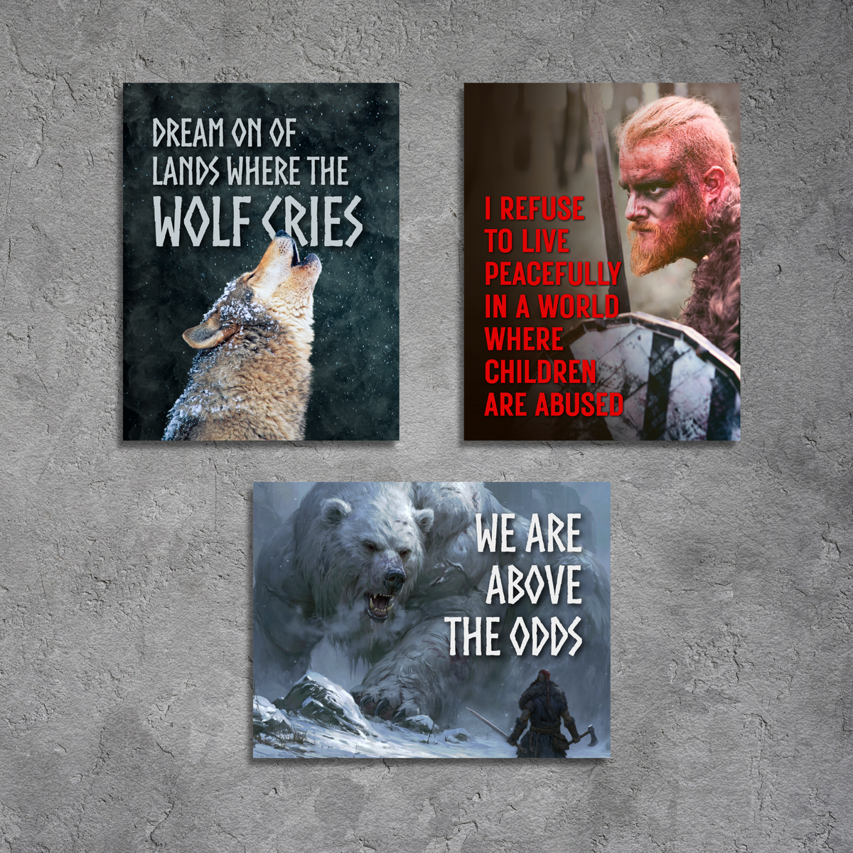 Three square wall art prints with bold text and dramatic wolf-themed imagery, displayed on a textured gray wall. The top-left print shows a wolf howling with the text 'DREAM ON OF LANDS WHERE THE WOLF CRIES', the top-right print shows a viking man with the text 'I REFUSE TO LIVE PEACEFULLY IN A WORLD WHERE CHILDREN ARE ABUSED'. The bottom print features a man fighting a dragon sized bear with the text 'WE ARE ABOVE THE ODDS'.