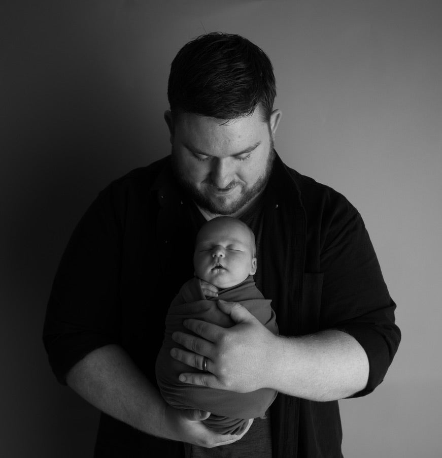 Photo of Easton J. Thomson with one of his babies